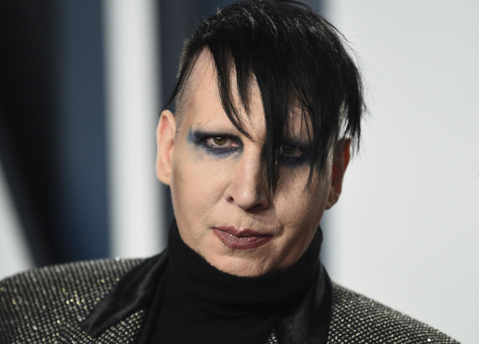 FILE - Marilyn Manson arrives at the Vanity Fair Oscar Party, Feb. 9, 2020, in Beverly Hills, Calif. On Tuesday, May 9, 2023, a California judge threw out key sections of Manson's lawsuit against his former fiancée, “Westworld” actor Evan Rachel Wood, claiming she fabricated public allegations that he sexually and physically abused her during their relationship and encouraged other women to do the same. (Photo by Evan Agostini/Invision/AP, File)