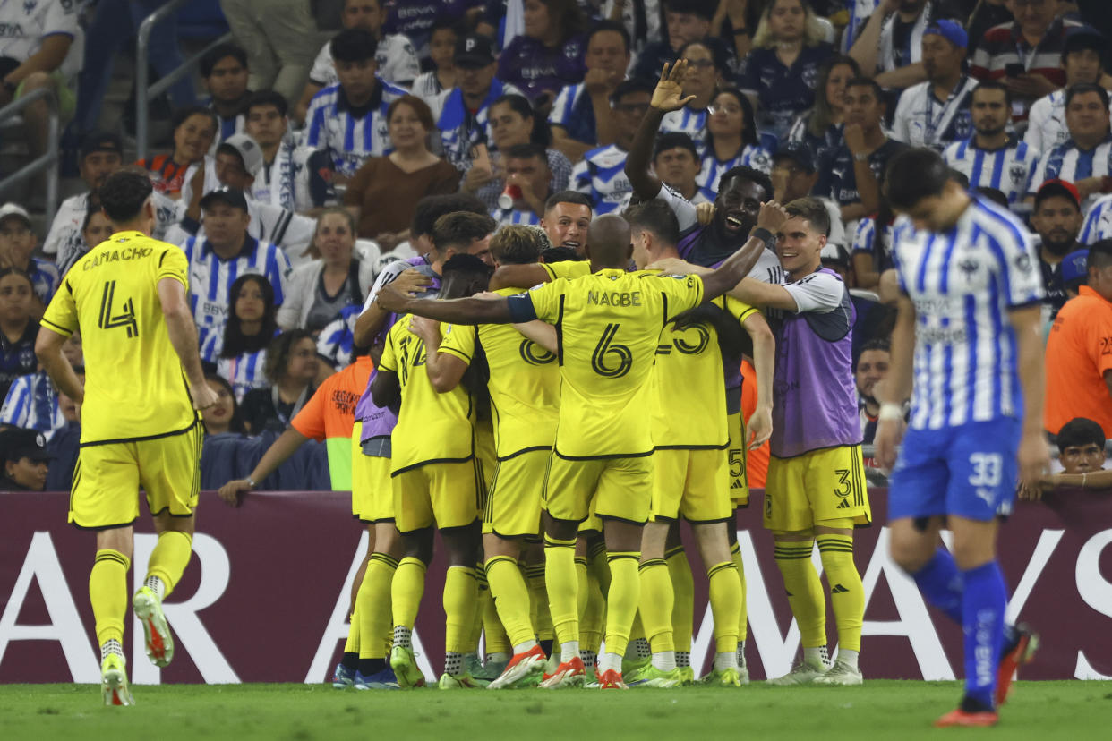 United States' Columbus Crew players congratulate teammate Diego Rossi after scoring a goal against Monterrey, during a CONCACAF Champions Cup semifinal second leg soccer match at the BBVA stadium in Monterrey, Mexico, Wednesday, May 1, 2024. (AP Photo/Alberto Lopez)