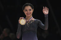 <p>Russia’s Evgenia Medvedeva poses on the podium with her gold medal after she won the Ladies event at the ISU Grand Prix of Figure Skating in Paris on November 12, 2016. / AFP / LIONEL BONAVENTURE </p>