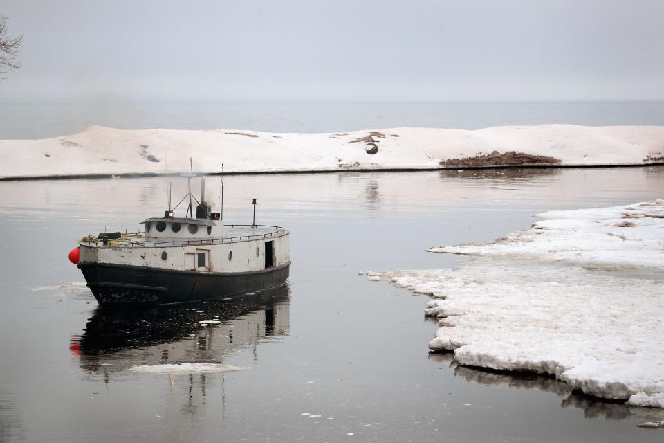 The crew of the Three Suns fishing boat heads out to check nets on Lake Superior from Black River Harbor on March 27, 2017 near Ironwood, Michigan. The Three Suns, built in 1944 by the Burger Boat Company, is owned and operated by the Peterson family who have worked as commercial fishermen on Lake Superior for five generations.