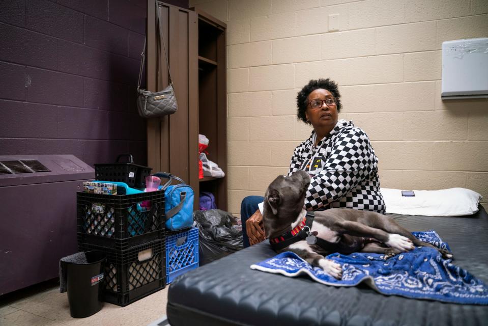 Tonya Hogan, 50, rests with her dog Pepper after packing her belongings to leave the Harbor Light Salvation Army in Detroit on Monday, May 1, 2023. 'It's been an emotional roller coaster. I get up and then fall back down, so today is kind of bittersweet," said Hogan, who found shelter at the Salvation Army after the unexpected death of her husband. "I'm happy this part is done, but I know there is so much more that needs to be done."
