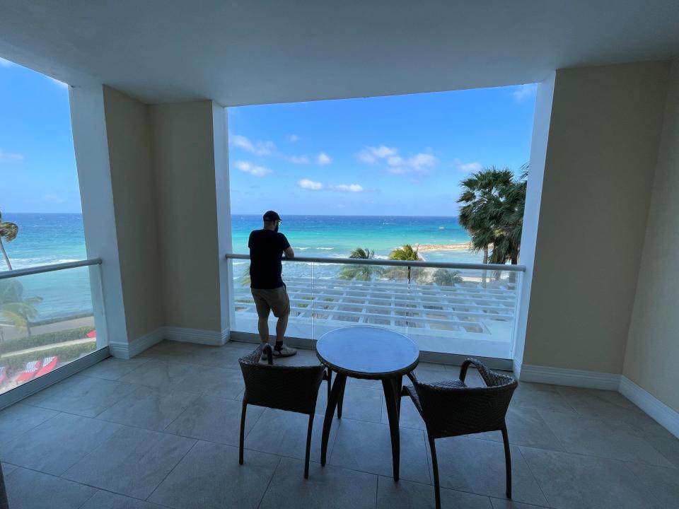 Jewel Grande in Montego Bay, person standing on private balcony overlooking water