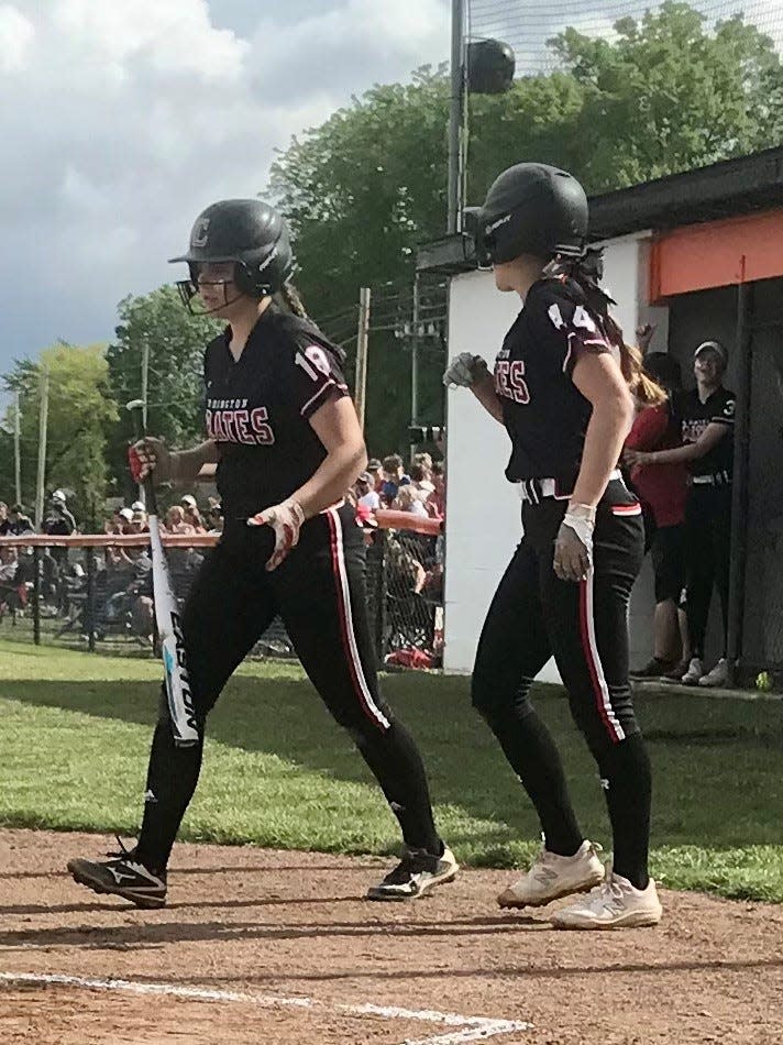 Cardington's Kayleigh Ufferman, left, and Riley Burchett talk after Burchett scored against Van Buren during Friday's Division III regional championship softball game at Elida.