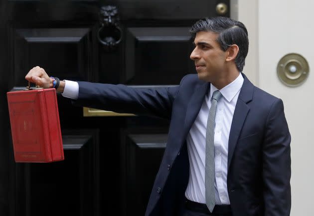 <strong>Chancellor Rishi Sunak stands with his red briefcase in front of 11 Downing Street in March.</strong> (Photo: via Associated Press)