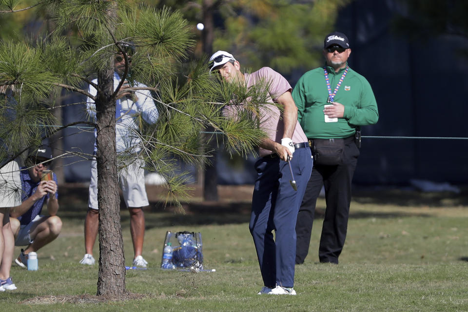 Martin Trainer hits out of the rough on the first hole fairway during the final round of the Houston Open golf tournament Sunday, Nov. 14, 2021, in Houston. (AP Photo/Michael Wyke)