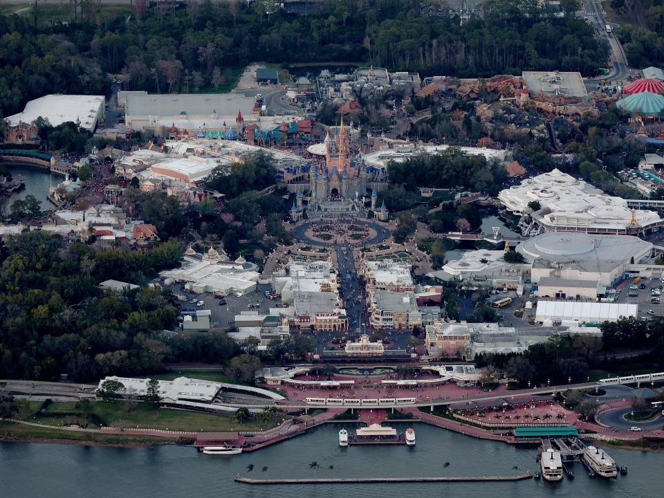 In an aerial view, Walt Disney World's iconic Cinderella Castle sits on the grounds of the Magic Kingdom theme park in the Walt Disney World resort.
