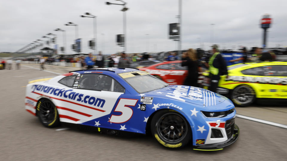 Kyle Larson (5) drives on pit road after making a run during qualifying for a NASCAR Cup Series auto race at Kansas Speedway in Kansas City, Kan., Saturday, Sept. 10, 2022. (AP Photo/Colin E. Braley)