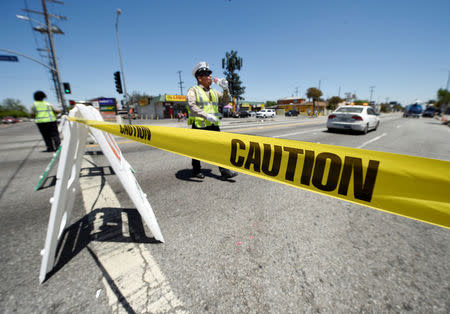 The intersection of Florence and Normandie Avenue, the flashpoint where the riots started 25 years ago, is blocked off by Los Angeles Department of Transportation officer after a march to remember and honor the victims of the 1992 Los Angeles riots in Los Angeles, California, U.S., April 29, 2017. REUTERS/Kevork Djansezian