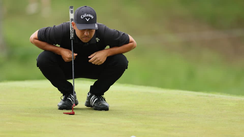 Schauffele lines up a putt. - Andy Lyons/Getty Images