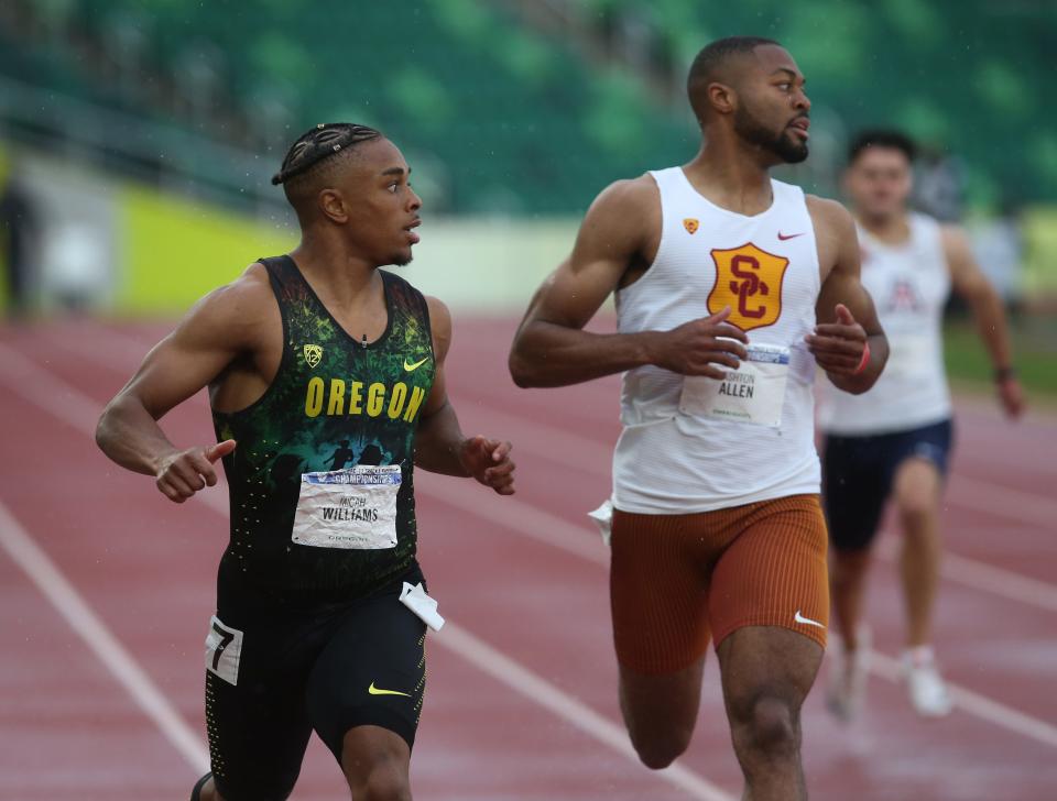 Micah Williams, left, wins his heat of the men's 200 meters ahead of SC's Ashton Allen during day one of the Pac-12 Track & Field Championships at Hayward Field in Eugene, Oregon May 13, 2022.