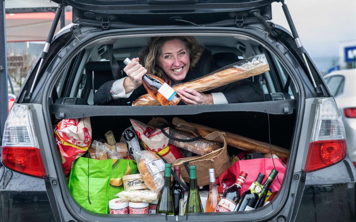 Tracey Davies with her bootful of booze after a trip to Calais