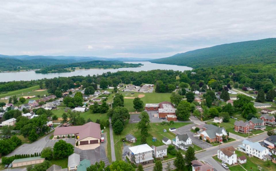 A aerial view over part of Howard Borough with the fire company and elementary school in the foreground and Bald Eagle State Park in the distance on Tuesday, June 11, 2024.