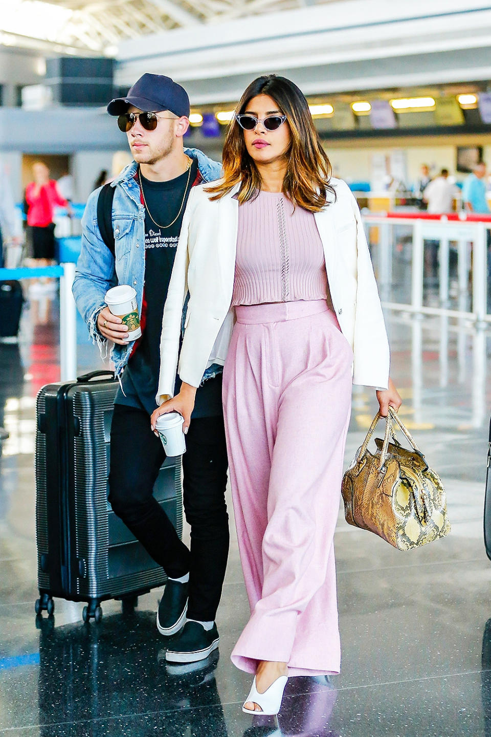 Priyanka Chopra looks chic in powder pink wide-legged trousers while on a coffee date with Nick Jonas. 