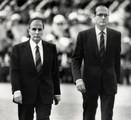 FILE PHOTO: File photo of French President Francois Mitterrand and Jacques Chirac, French Prime Minister and Mayor of Paris, attending a ceremony in Paris