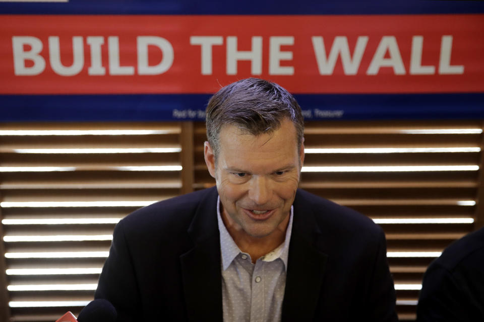 Former Kansas Secretary of State Kris Kobach talks to the media after announcing his candidacy for the Republican nomination for the U.S. Senate Monday, July 8, 2019, in Leavenworth, Kan. (AP Photo/Charlie Riedel)