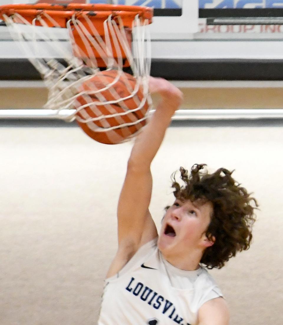 Louisville's Will Aljancic dunks the basketball vs. Woodridge during the Spectrum Orthopaedics Classic at North Canton Hoover High School on Saturday, Jan. 15, 2022.