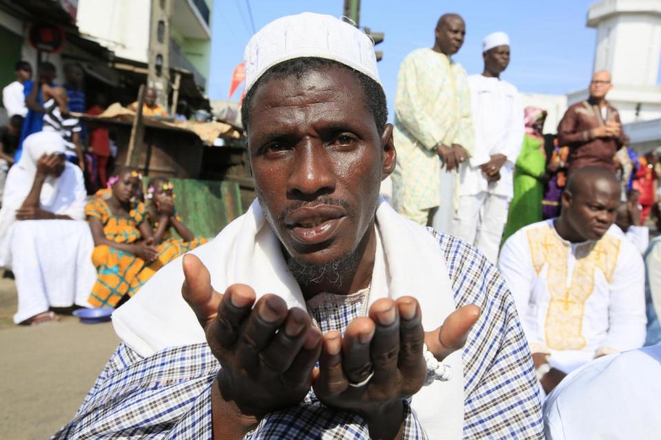 Ivorian Muslims pray during the first day of the Muslim festival of Eid-al-Adha in Abidjan, Ivory Coast (EPA)