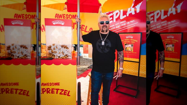 Guy Fieri at a pretzel cart