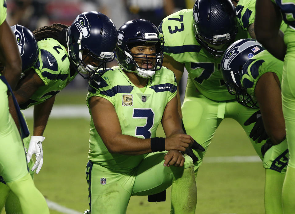 The Seattle Seahawks have been fined for not properly following concussion protocol after game referee Walt Anderson suspected quarterback Russell Wilson, center, suffered a brain injury on Nov. 9 against Arizona. (AP)