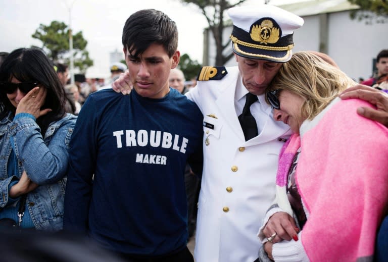 Photo released by Telam of relatives and friends of the crew members of the ARA San Juan submarine, mourning during a ceremony a year after the submarine went missing, at Mar del Plata's naval base, in Buenos Aires province on November 15, 2018