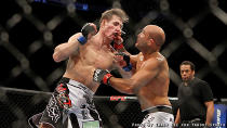 BJ Penn lands a punch on Rory MacDonald during their fight at UFC on Fox 5. (Credit: Tracy Lee for Yahoo! Sports)