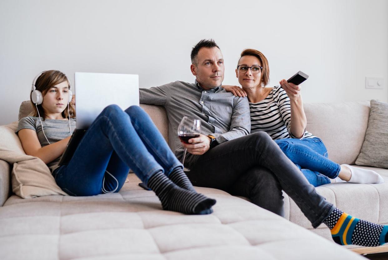 <span class="caption">More people turn to alcohol in the wake of disasters, research has found.</span> <span class="attribution"><a class="link " href="https://www.gettyimages.com/detail/photo/family-relaxing-on-sofa-at-home-royalty-free-image/1217703099?adppopup=true" rel="nofollow noopener" target="_blank" data-ylk="slk:Kerkez/GettyImages;elm:context_link;itc:0;sec:content-canvas">Kerkez/GettyImages</a></span>