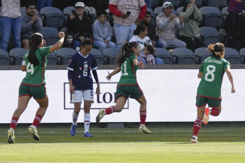 Mexico midfielder Jacqueline Ovalle (11) celebrates after scoring against Paraguay during the first half of a CONCACAF Gold Cup women's soccer tournament quarterfinal match, Sunday, March 3, 2024, in Los Angeles. (AP Photo/Marcio Jose Sanchez)
