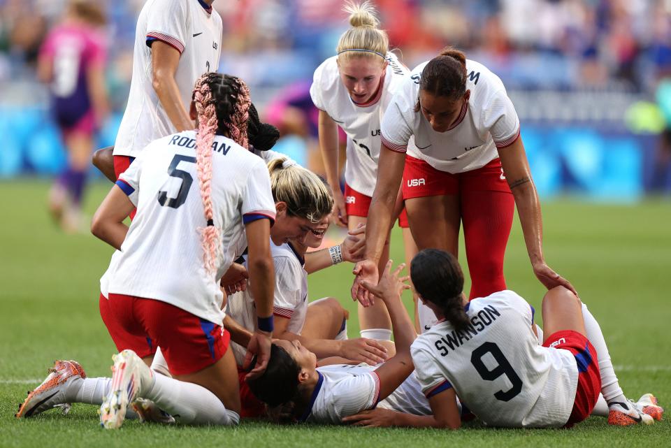 Sophia Smith's teammates celebrated with her after her overtime goal against Germany in the Olympic semifinal.