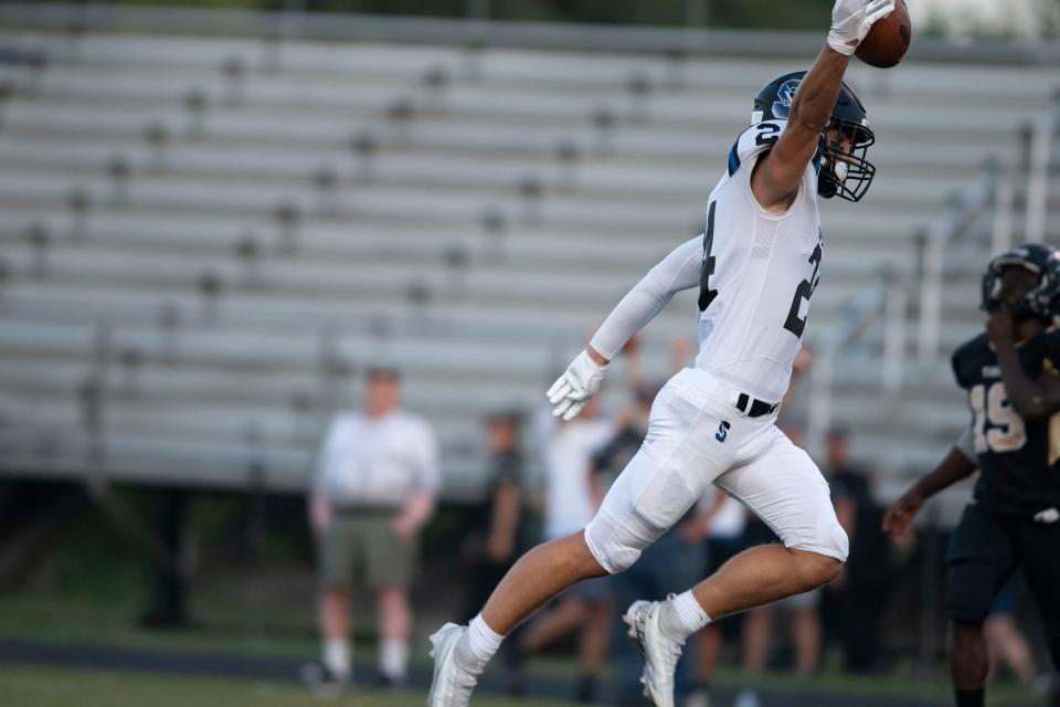 CB South senior Jack Carver runs to the endzone with the ball for a touchdown at Harry S. Truman High School in Levittown on Friday, Sept. 2, 2022. The Tigers fell to the Titans 35-8.