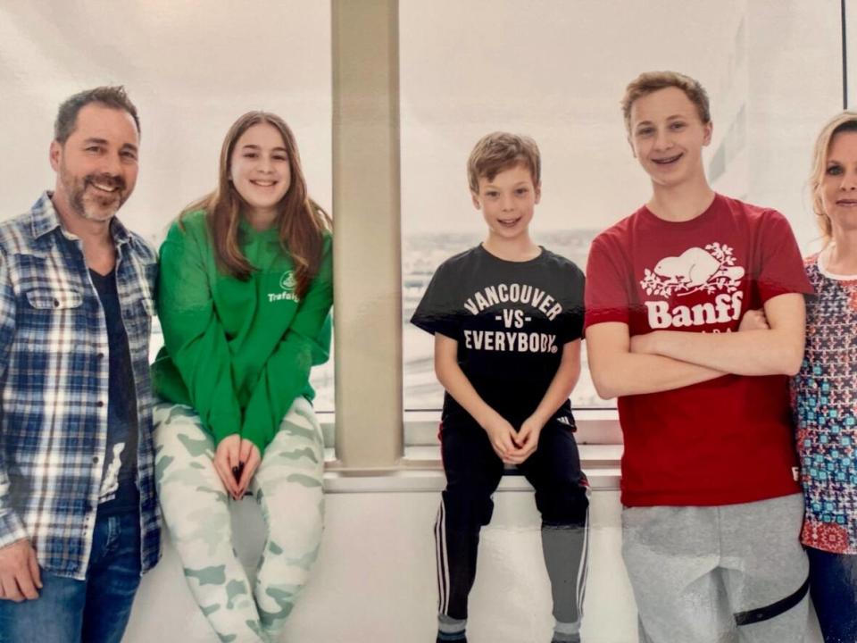 From left to right: Rodney Dawes, Ashley Dawes, Evan Dawes, Jacob Dawes and Rose Bloom. The Saint-Lazare family donated an automated external defibrillator (AED) to the city after the device helped save Jacob's life after an incident in 2019.  (Submitted by Rose Bloom - image credit)