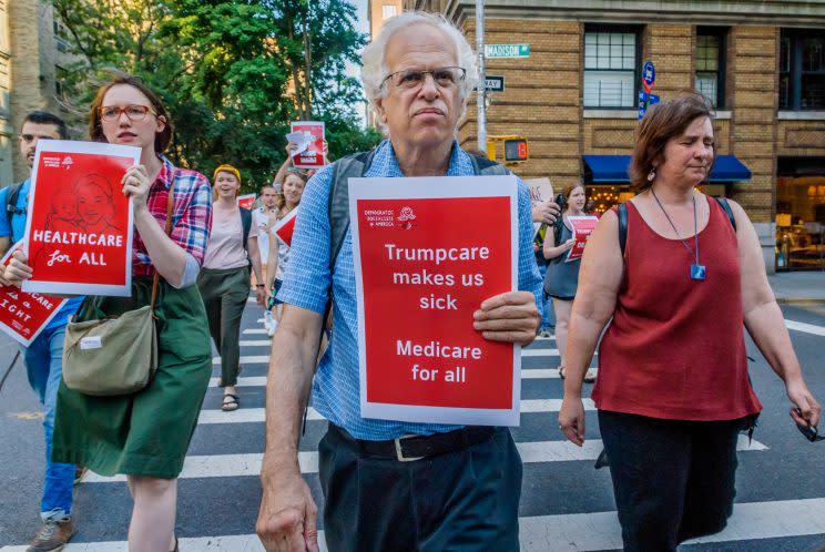 The Socialist Feminists of Democratic Socialists of America (DSA) organized a protest outside of the New York County Republican Office in New York City on July 5, 2017 to tell Republicans that is it despicable and undemocratic that they are trying to ram Trumpcare through the Senate without debate or public hearings.