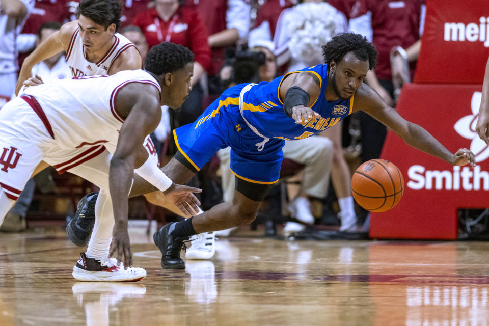 Morehead State guard Branden Maughmer, right, and Indiana guard Xavier Johnson dive for the ball during the second half of an NCAA college basketball game Monday, Nov. 7, 2022, in Bloomington, Ind. (AP Photo/Doug McSchooler)