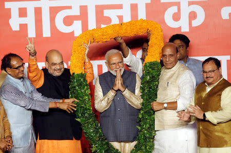 BJP President Amit Shah and Indian Prime Minister Narendra Modi react after the election results in New Delhi, India, May 23, 2019. REUTERS/Adnan Abidi