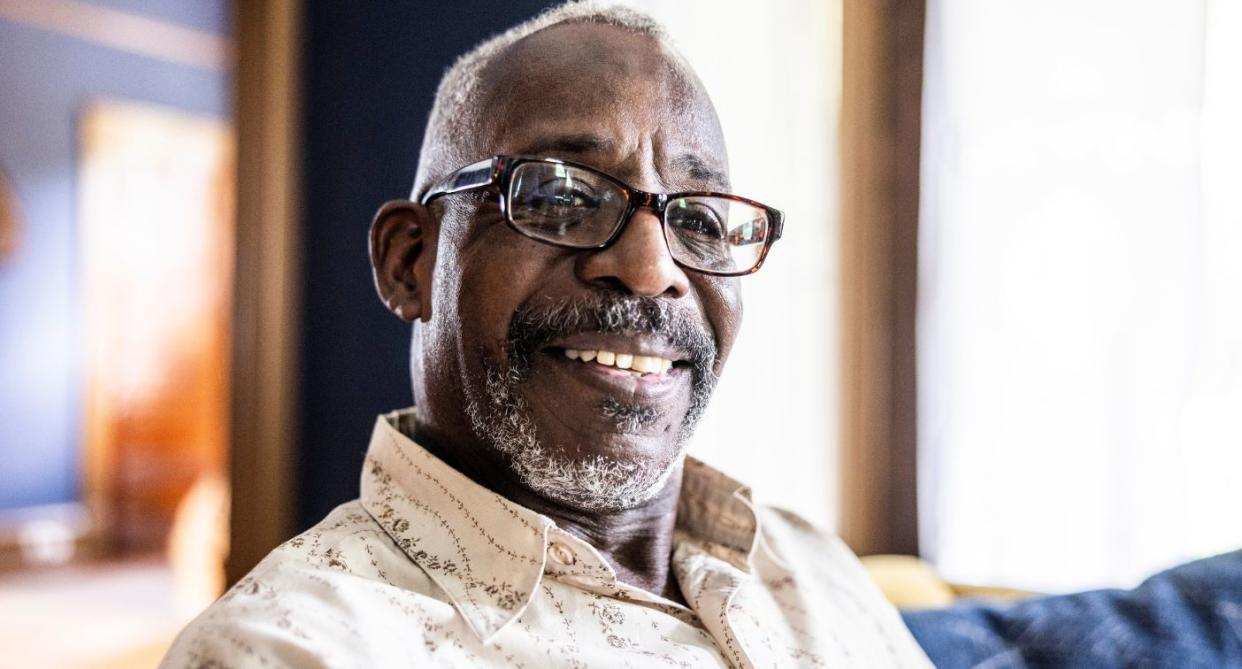 Man smiling at camera, representing someone with Parkinson's disease. (Getty Images)