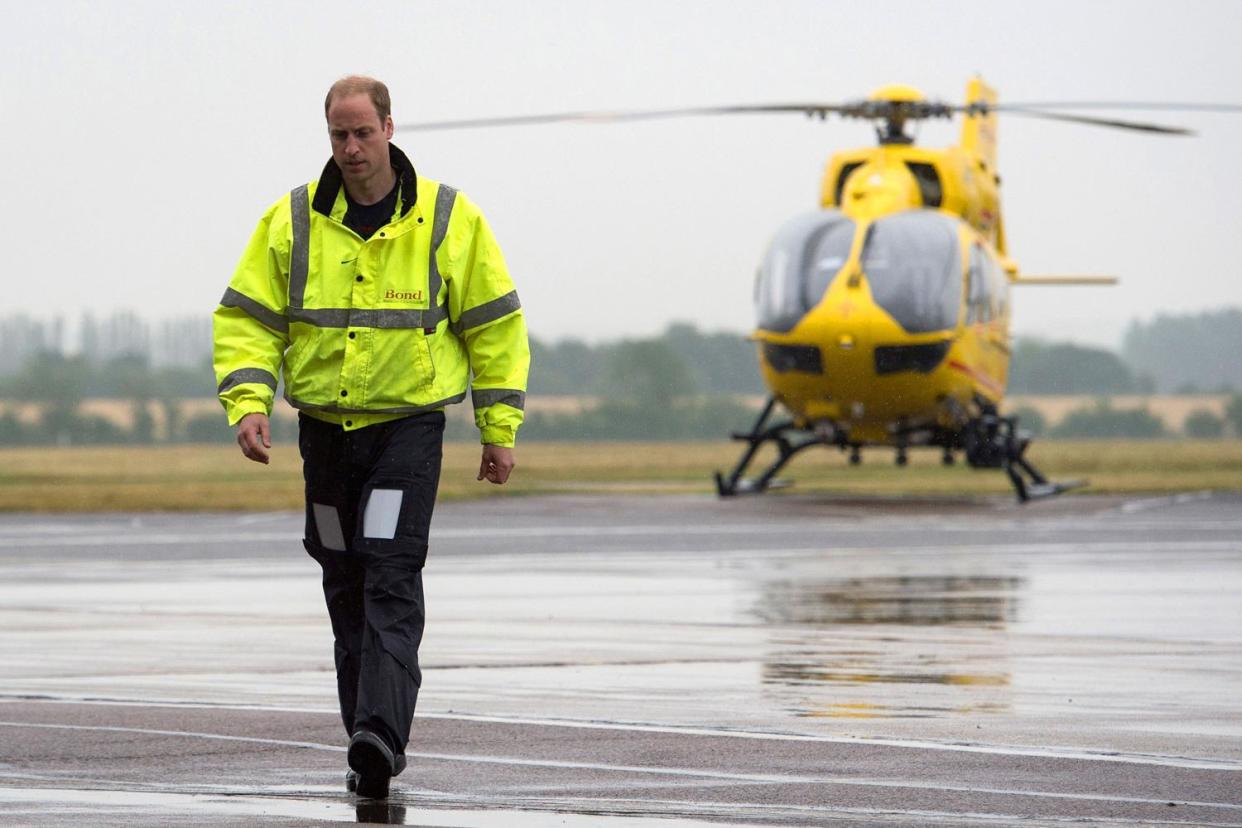 Prince Wililam pictured walking away from the air ambulance helicopter as he told of his 'pride' at having served