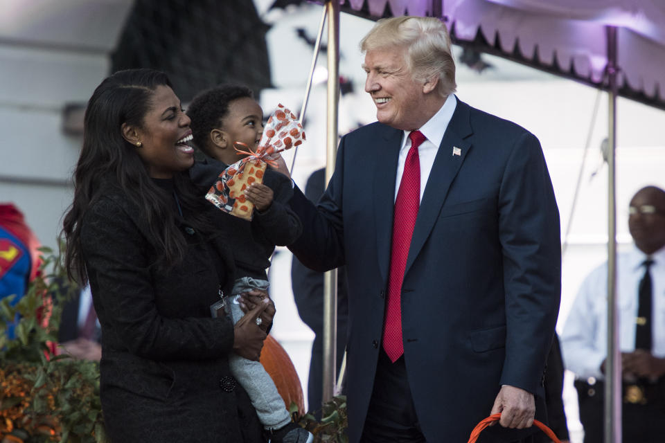 WASHINGTON, DC - OCTOBER 30: White House Director of communications for the Office of Public Liaison Omarosa Manigault talks with President Donald Trump as he hands out treats as they welcome children from the Washington area and children of military families to trick-or-treat for Halloween at the South Lawn of the White House in Washington, DC on Monday, Oct. 30, 2017. (Photo by Jabin Botsford/The Washington Post via Getty Images)
