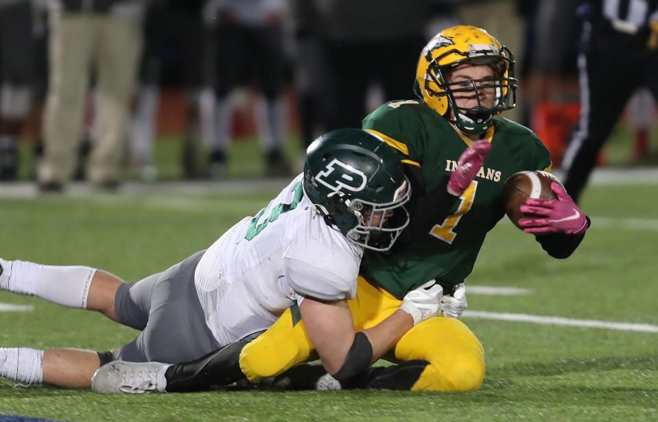 Pleasantville's Kieran Cotter (3) tackles Ravena's Franky Broadhurst (1) for a loss on a big play late in the game  during the Class B state semifinal at Middletown High School Nov. 27, 2021. Pleasantville won the game 15-7.