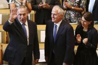 Israeli Prime Minister Benjamin Netanyahu, left, and Australian Prime Minister Malcolm Turnbull, center, arrive at the Central Synagogue in Sydney, Australia, Wednesday, Feb. 22, 2017. Netanyahu on Wednesday praised Australia for being "courageously willing to puncture U.N. hypocrisy" on Anti-Israel resolutions. Turnbull marked the first visit to Australia by a serving Israeli leader by writing an opinion piece in Wednesday's The Australian newspaper. (Mark Metcalfe/Pool via AP)