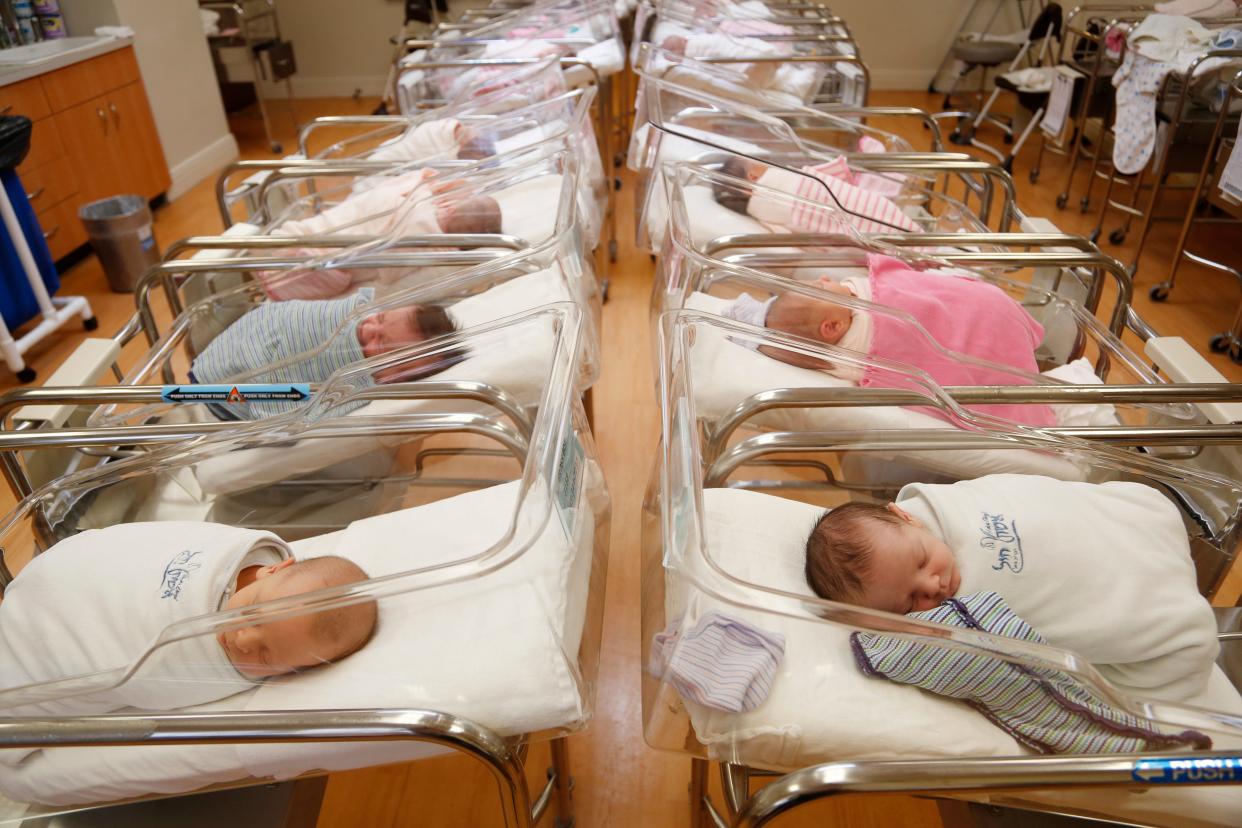 FILE - In this Feb. 16, 2017, file photo newborns rest in the nursery of Aishes Chayil, a postpartum recovery center, in Kiryas Joel, N.Y. Some parents are discovering that the Social Security number assigned to their newborn is being used by criminals to commit fraud. Identity theft experts recommend that parents freeze their children’s credit now to help prevent problems in the future. (AP Photo/Seth Wenig, File)