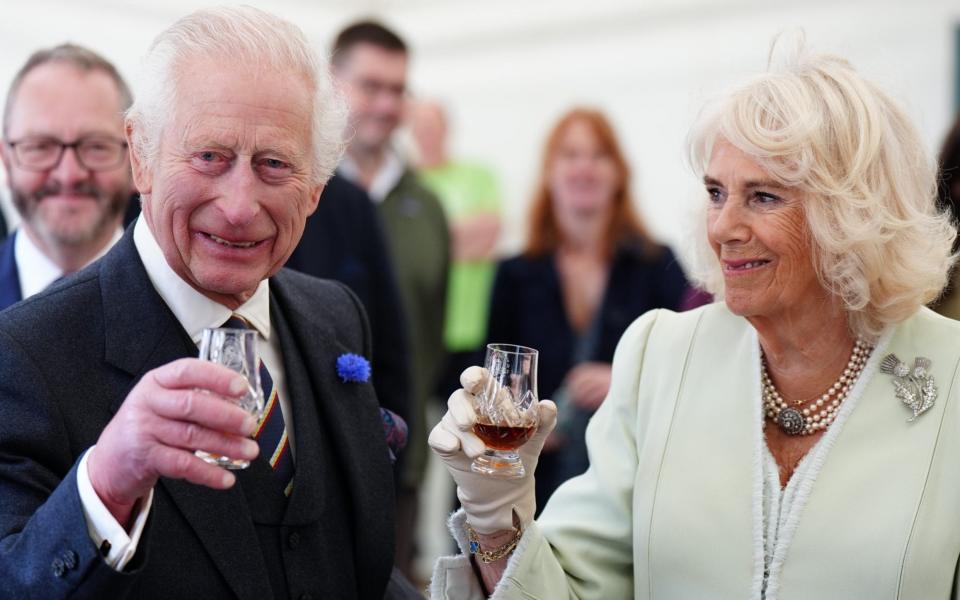 King Charles III and Queen Camilla try large drams of the 52-year-old Macallan