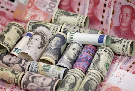 Euro, Hong Kong dollar, U.S. dollar, Japanese yen, pound and Chinese 100 yuan banknotes are seen in this picture illustration, in Beijing, China, January 21, 2016. REUTERS/Jason Lee