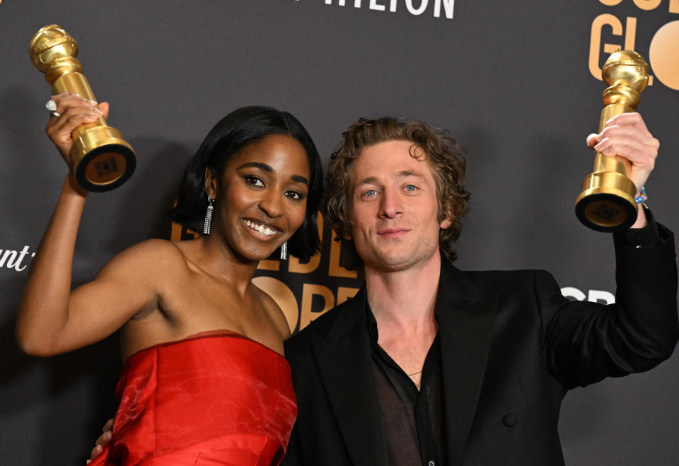 Ayo Edebiri and Jeremy Allen White pose with their Golden Globes after winning for best performance by an actress and actor in a television series, musical of comedy, for their roles in 