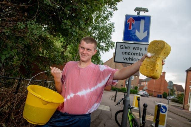 Selfless teen becomes local hero after cycling through his town almost every day during lockdown cleaning dirty road signs and cutting back overgrown hedges across pavements and pathways