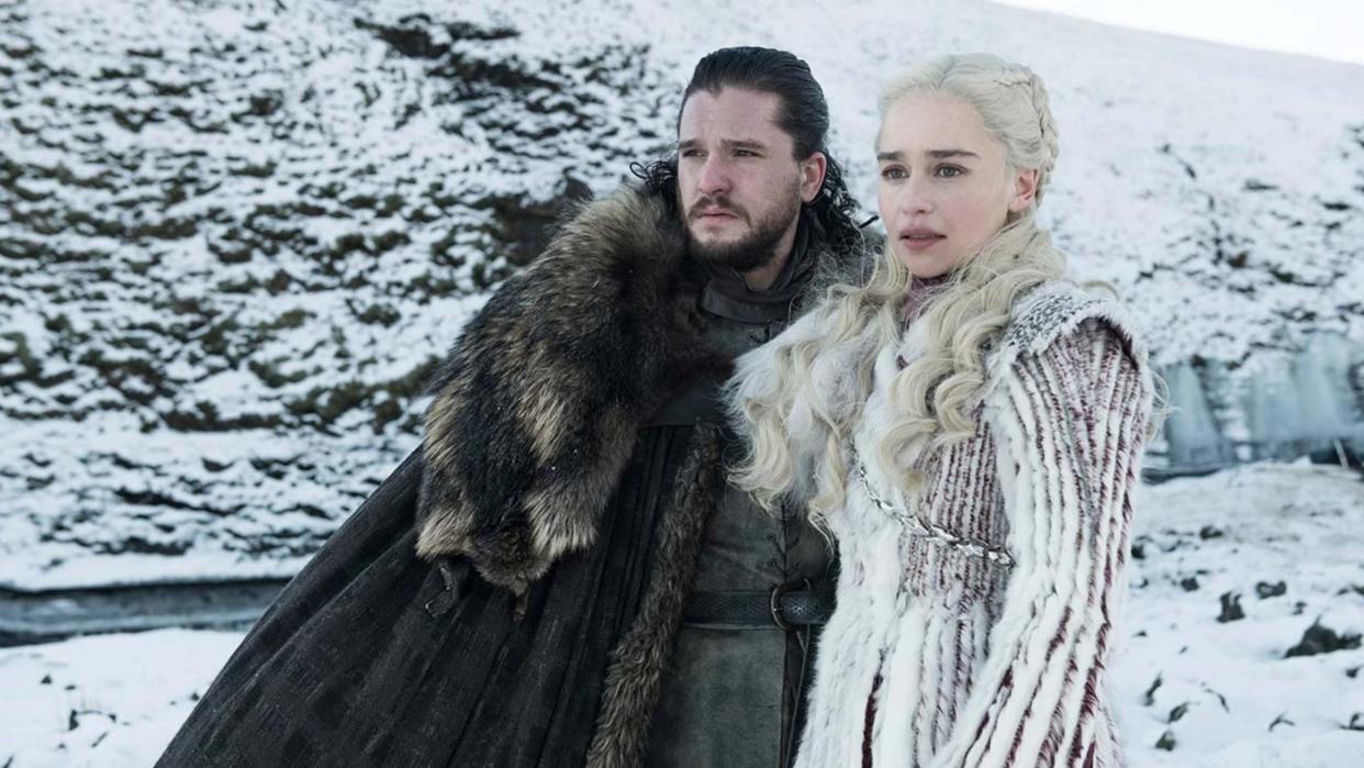  (L, R) Kit Harrington as Jon Snow and Emilia Clarke as Daenerys Targaryen in snowy location in Game of Thrones 