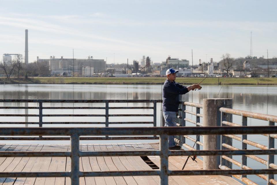 DALLAS, TX - JANUARY 30, 2024: Charles Langoria, 47, a West Dallas resident, volunteers to fish at Fish Trap Lake Park in Dallas, Texas on Tuesday, Jan. 30, 2024. The city of Dallas and local community leaders partnered with the EPA on the Cumulative Impacts Assessment Pilots Project, which focuses on the cumulative impacts from concrete batch plants. CREDIT: Desiree Rios for The Texas Tribune