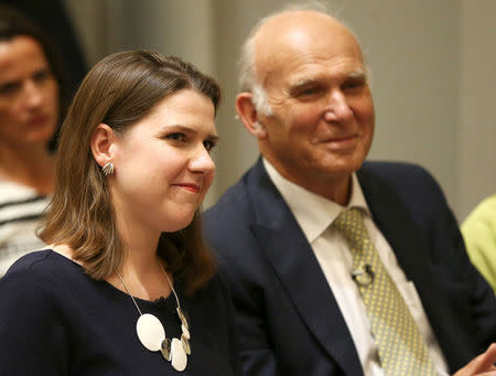 Vince Cable, the new leader of Britain's Liberal Democrats sits next to new deputy leader Jo Swinson at the announcement of his appointment in London, July 20, 2017. REUTERS/Neil Hall