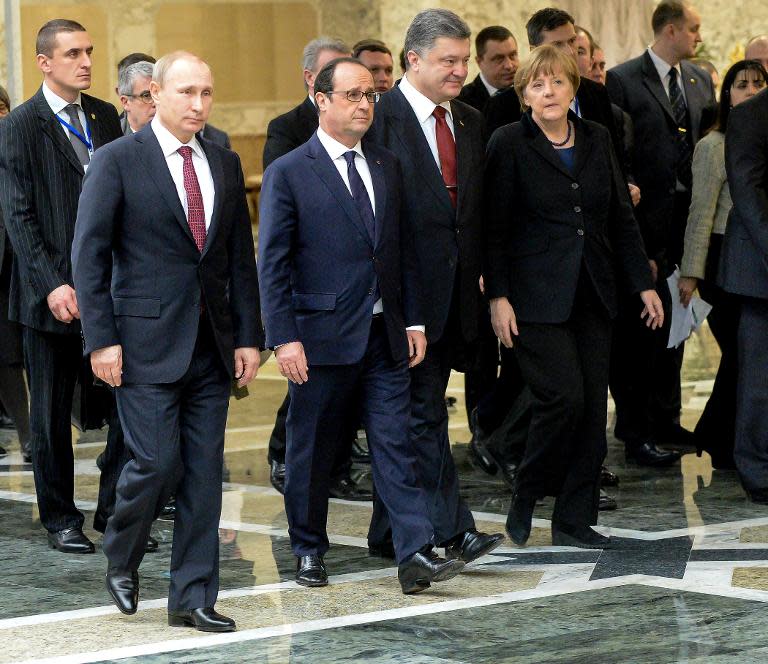 Le président russe Vladimir Poutine (gauche), le président François Hollande, le président ukrainien Petro Porochenko et la chancelière allemande Angela Merkel à Minsk le 11 février 2015