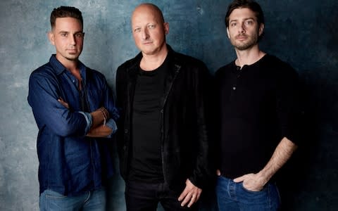 Wade Robson, from left, director Dan Reed and James Safechuck pose for a portrait to promote Leaving Neverland during the Sundance Film Festival - Credit: Taylor Jewell