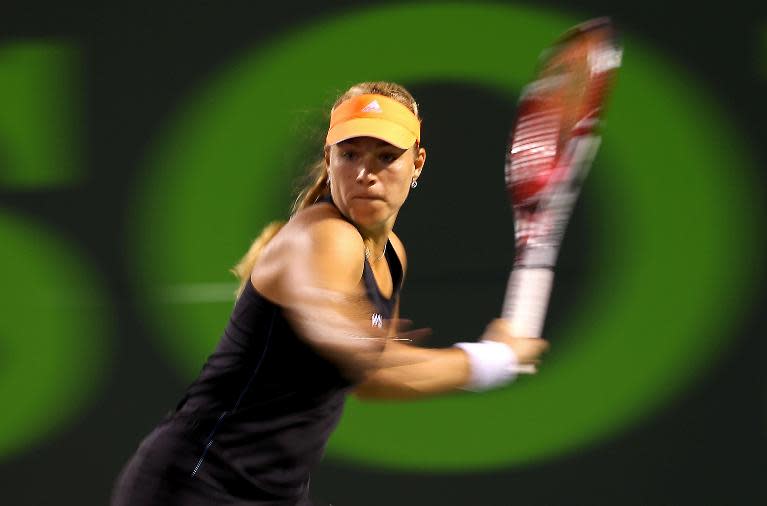 Angelique Kerber of Germany returns a shot to Serena Willaims during the Sony Open at Carndon Park Tennis Center on March 25, 2014 in Key Biscayne, Florida