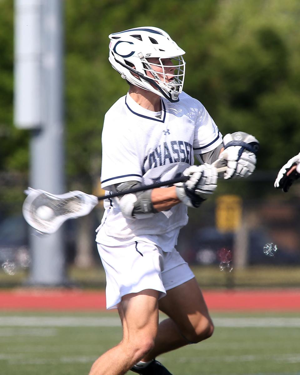 Cohasset's Liam Appleton rips a shot on goal during second quarter action of their game in the Division 4 state semifinal game against Weston at Weymouth High School on Thursday, June 15, 2023. 